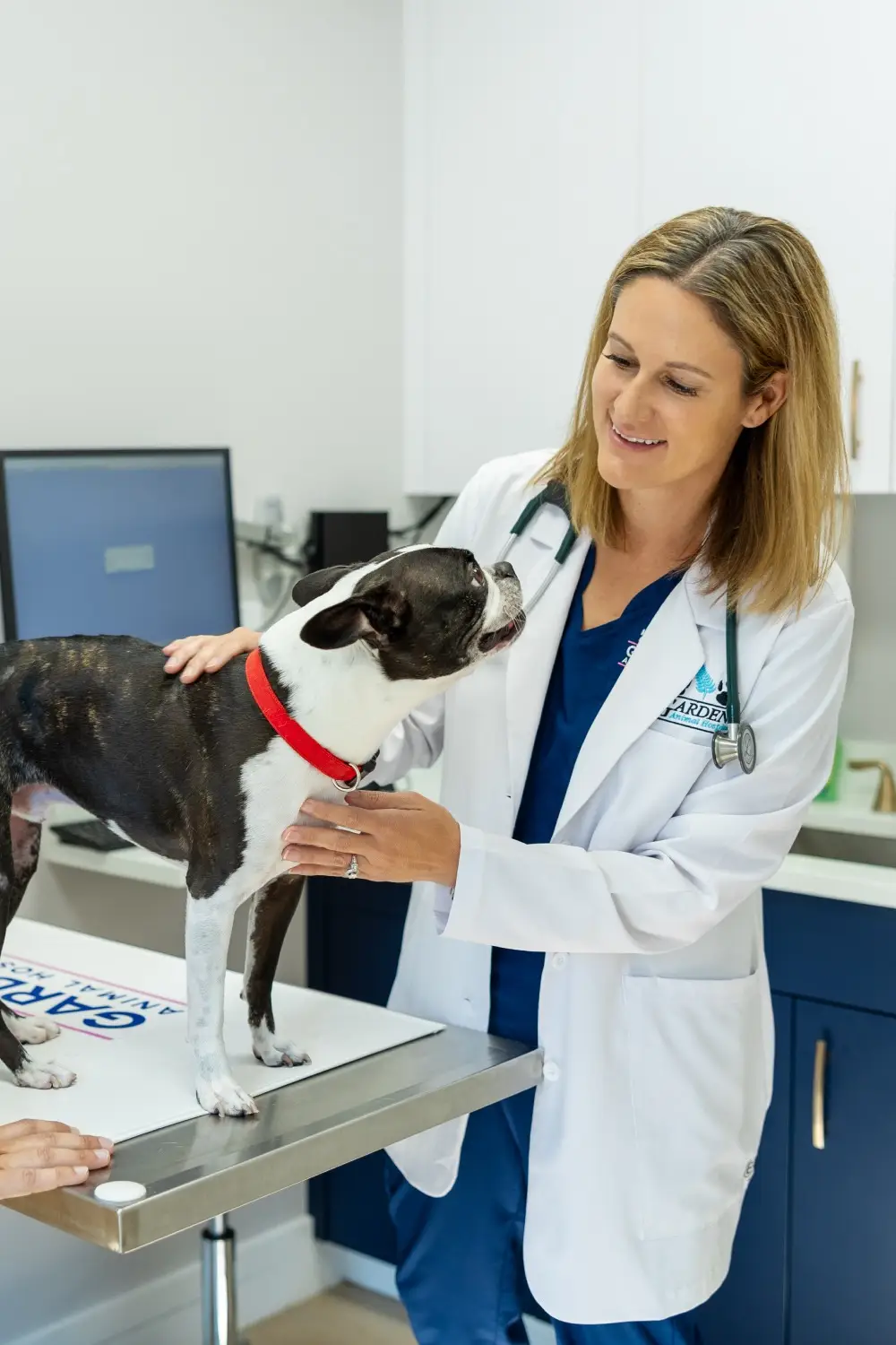 Dr Lisa Ciucci smiling with a dog